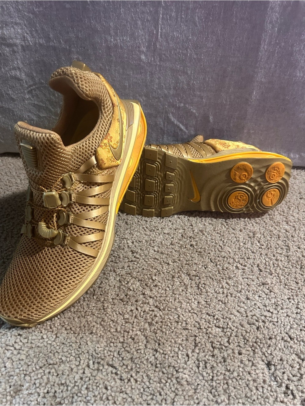 Women’s Nike Shox Gravity sneakers in metallic gold size 9